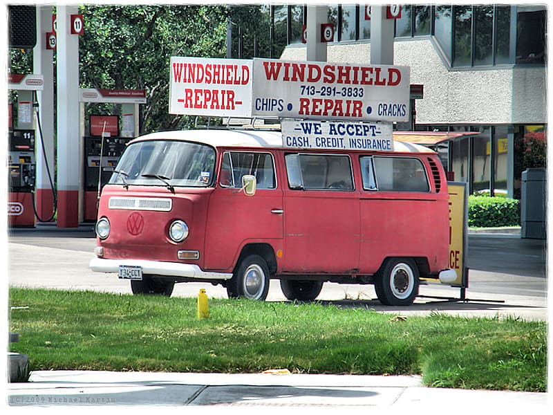Technician repairing a windshield